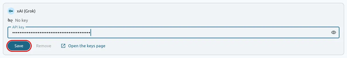 The xAI (Grok) card on FilmOpen’s Provider keys tab, saying No key, with a key pasted into API key and shown as dots, and the Save button outlined in red
